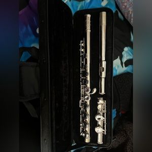 Brand new flute with accessories and book